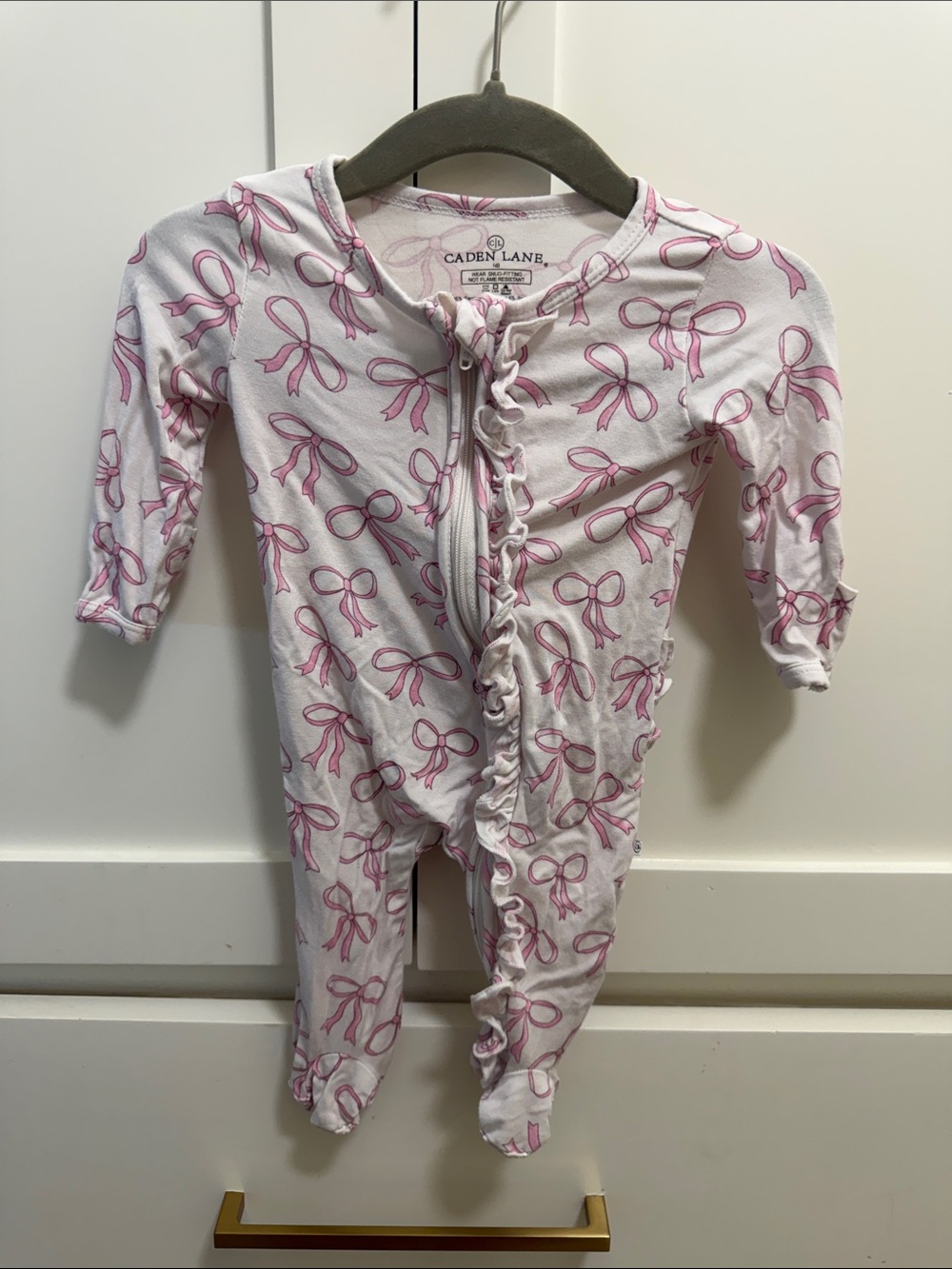 Caden Lane White One-Piece with Pink Bow Print and Ruffle Zip